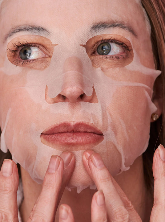 Woman wearing a sheet mask