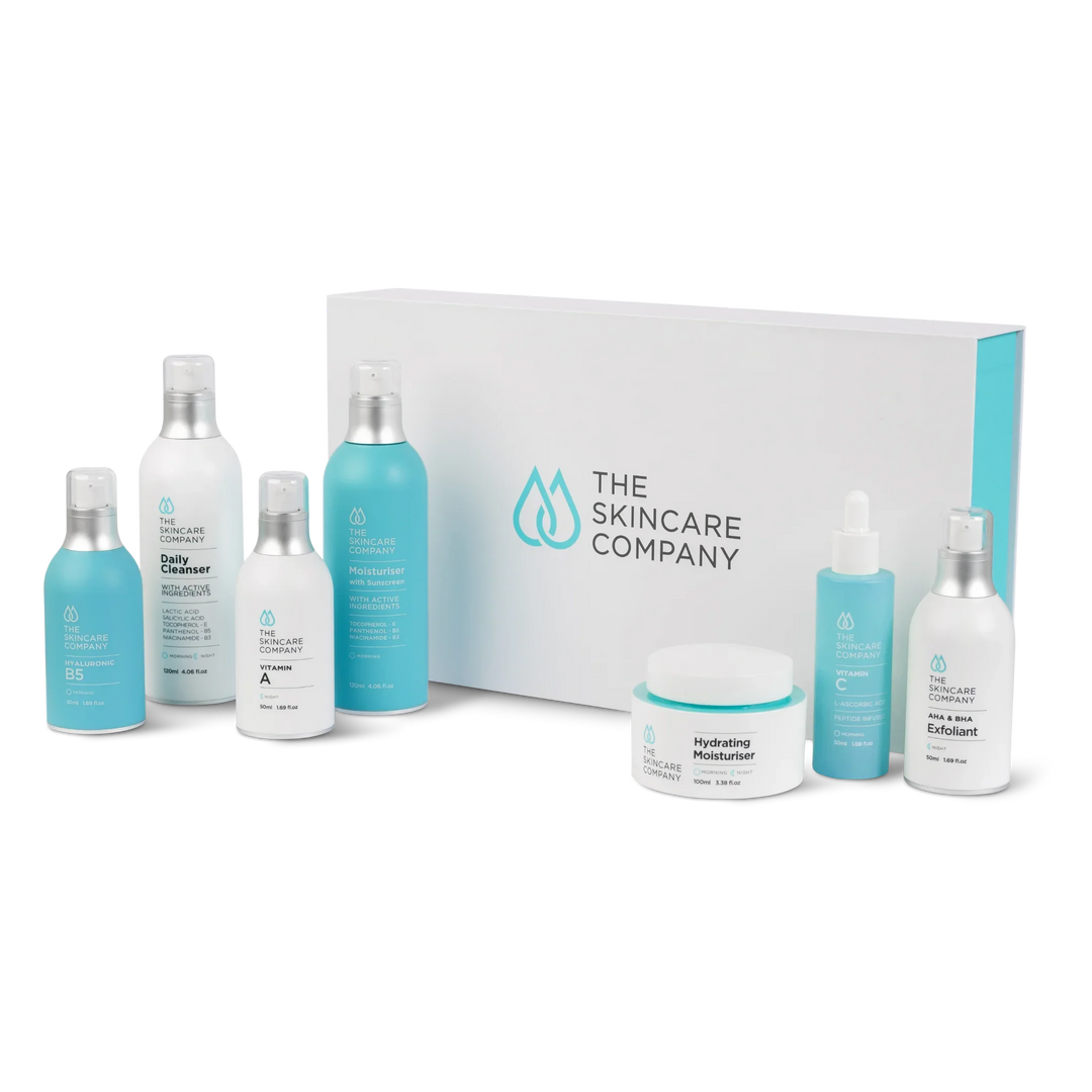 Anti-aging skincare treatment pack with cleanser, moisturiser, exfoliant, and serum bottles.